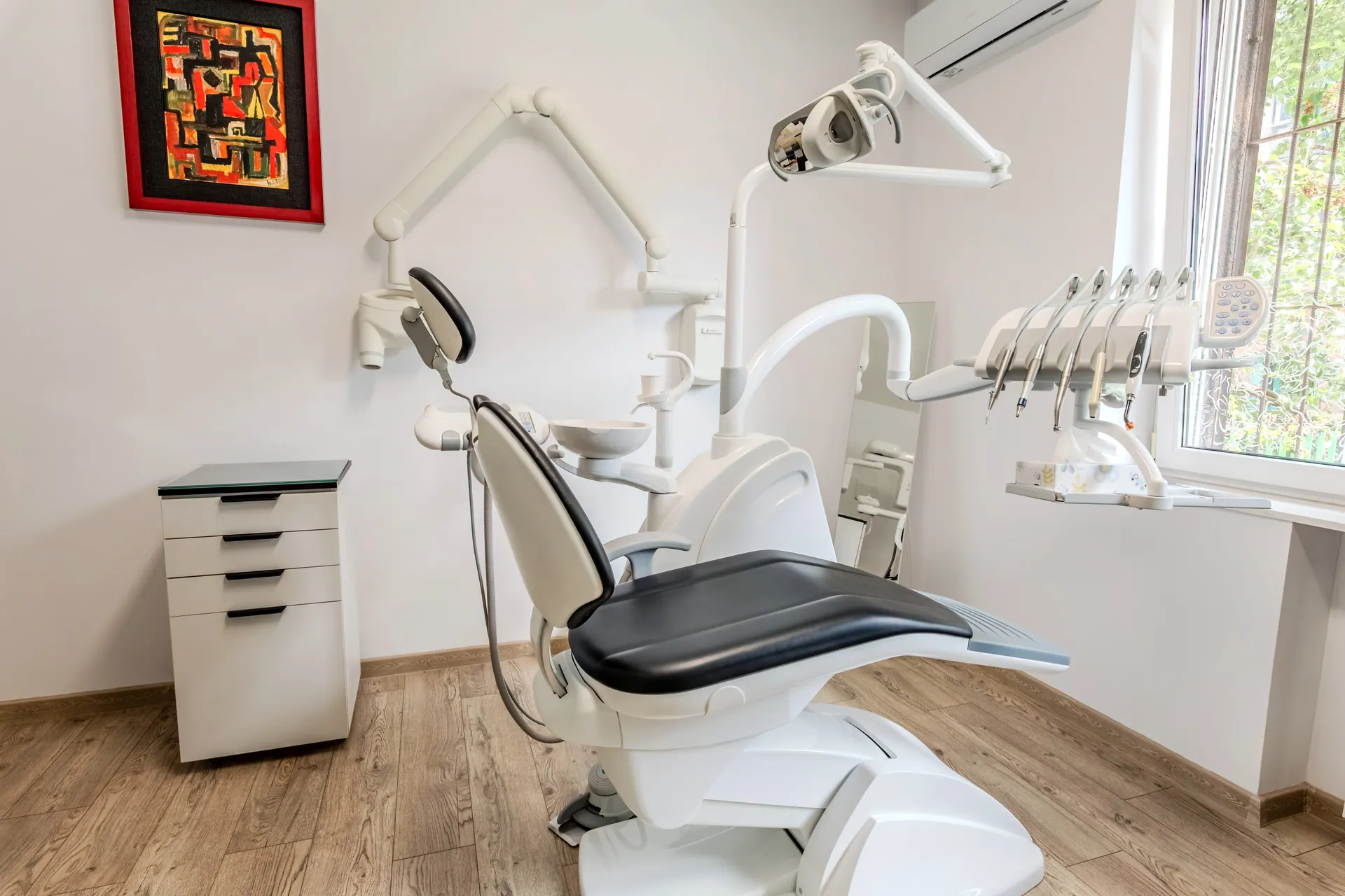 Modern treatment room at the Orto-vis clinic in Łódź, Poland — dental chair by the window.